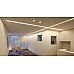The LED strip channels with diffusers illuminate the ceiling